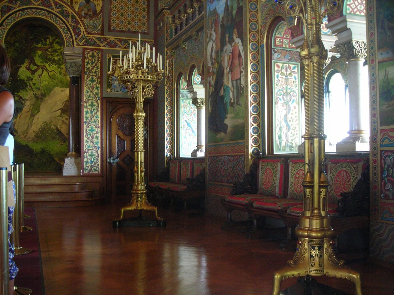 A painted hall of Germanic legend Painted hall inside Hohenschwangau Castle with gilded candelabra and legend murals