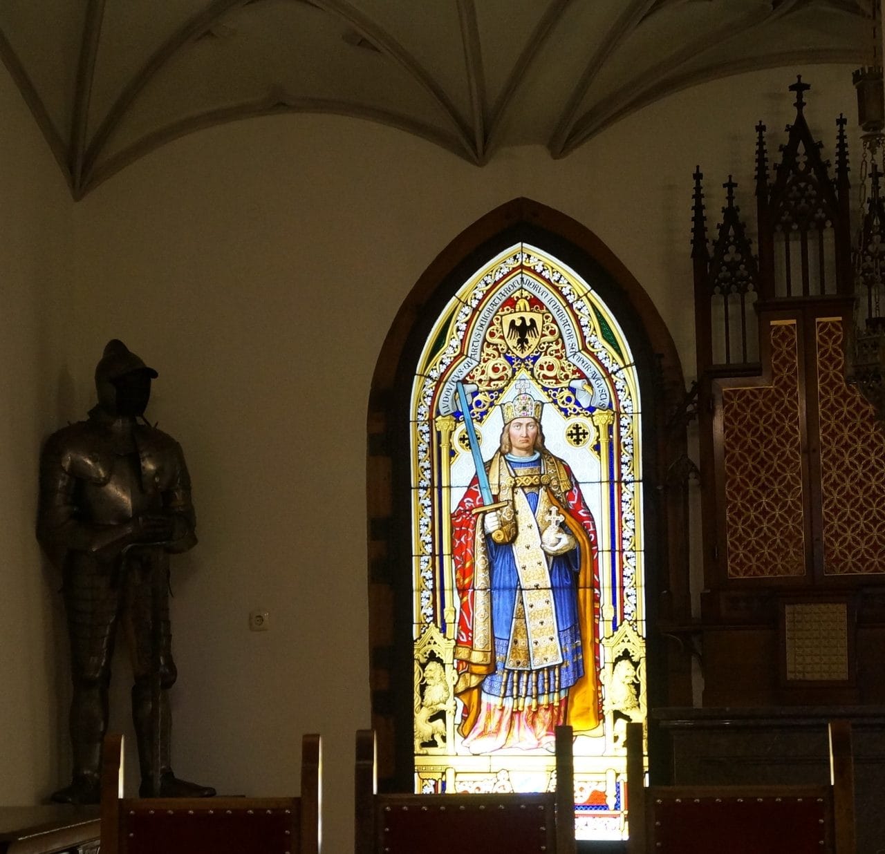 Hohenschwangau Castle 3 Stained-glass window of Emperor Ludwig the Bavarian beside a suit of armor in Hohenschwangau Castle