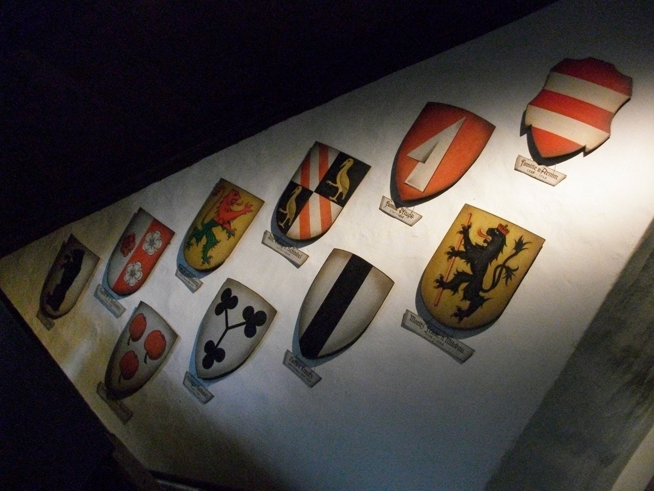 Painted shields of the families who owned Kriebstein Castle across six centuries