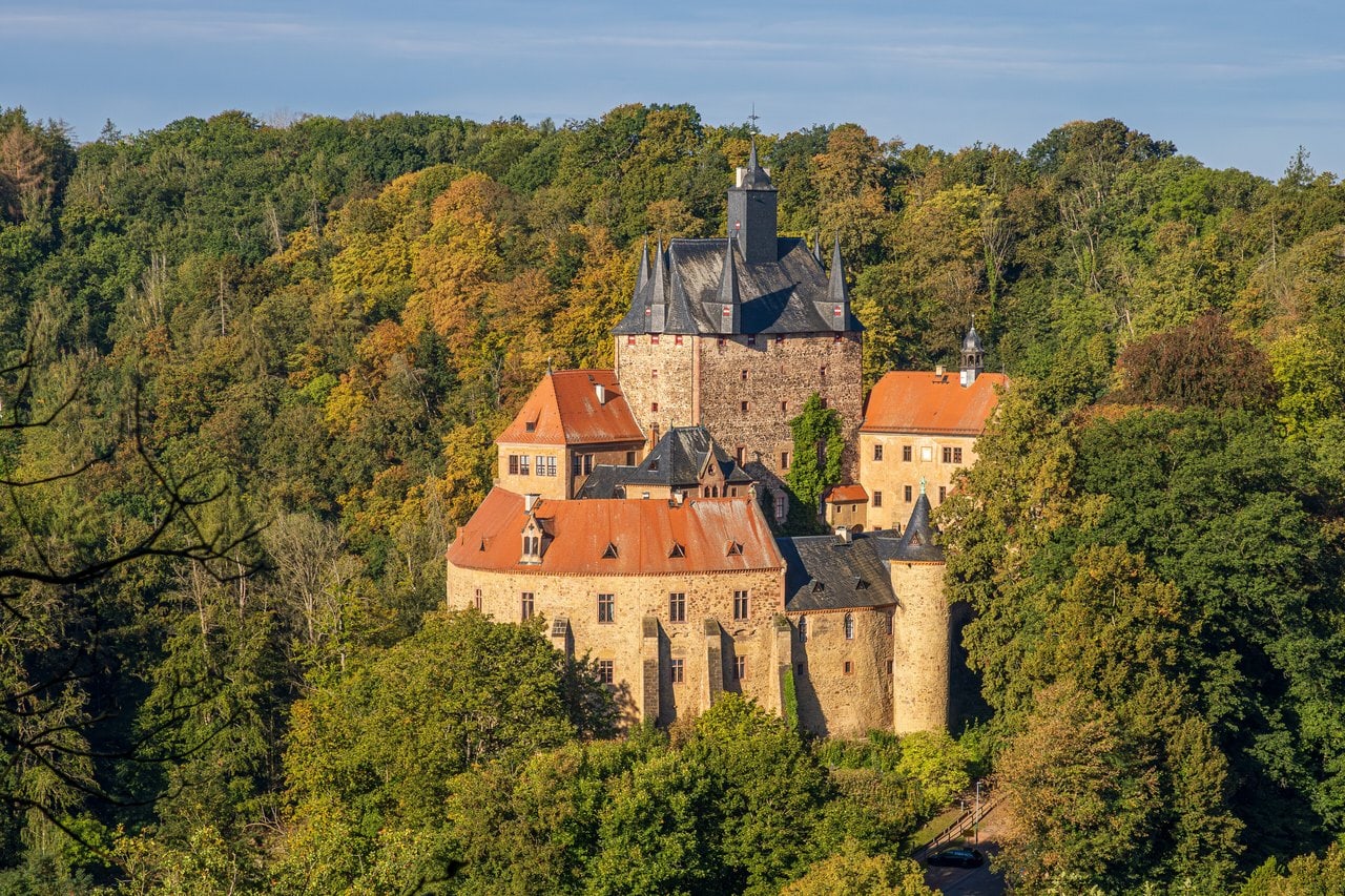 Castles of Saxony 4 Kriebstein Castle on a wooded rock spur above a bend of the Zschopau river in autumn.