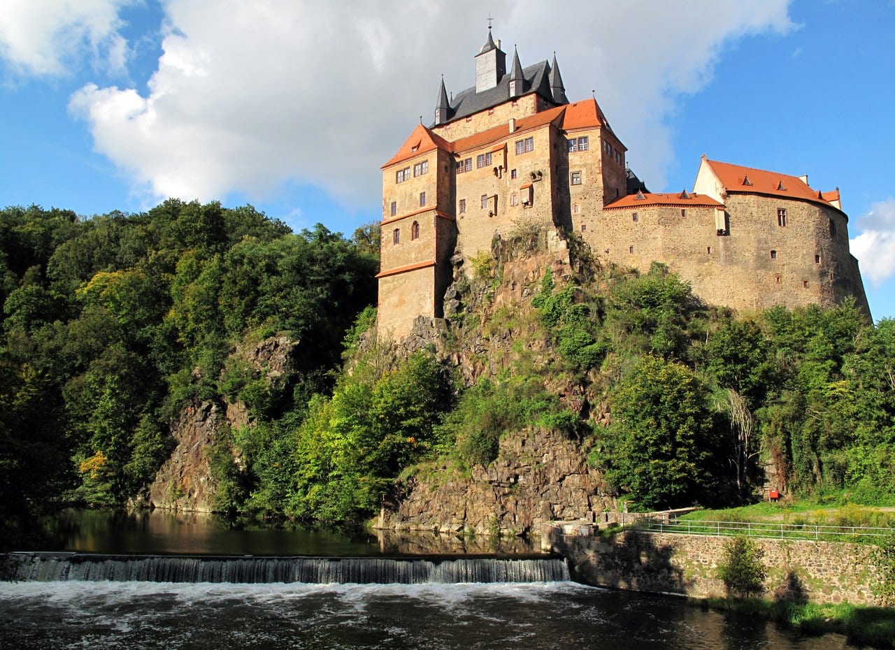 Kriebstein Castle on its rock spur above the Zschopau river and weir in Saxony