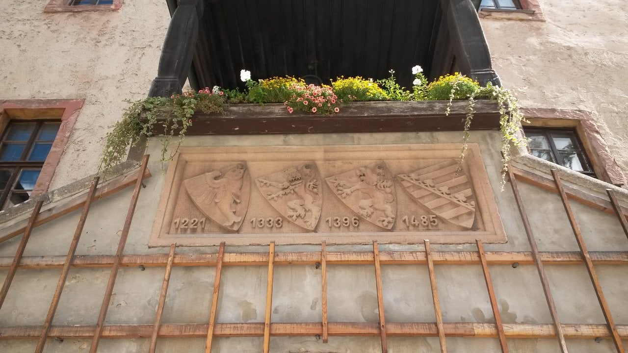 Leuchtenburg Castle 3 Carved stone relief of four coats of arms with the dates 1221, 1333, 1396 and 1485 marking changes of ownership at Leuchtenburg