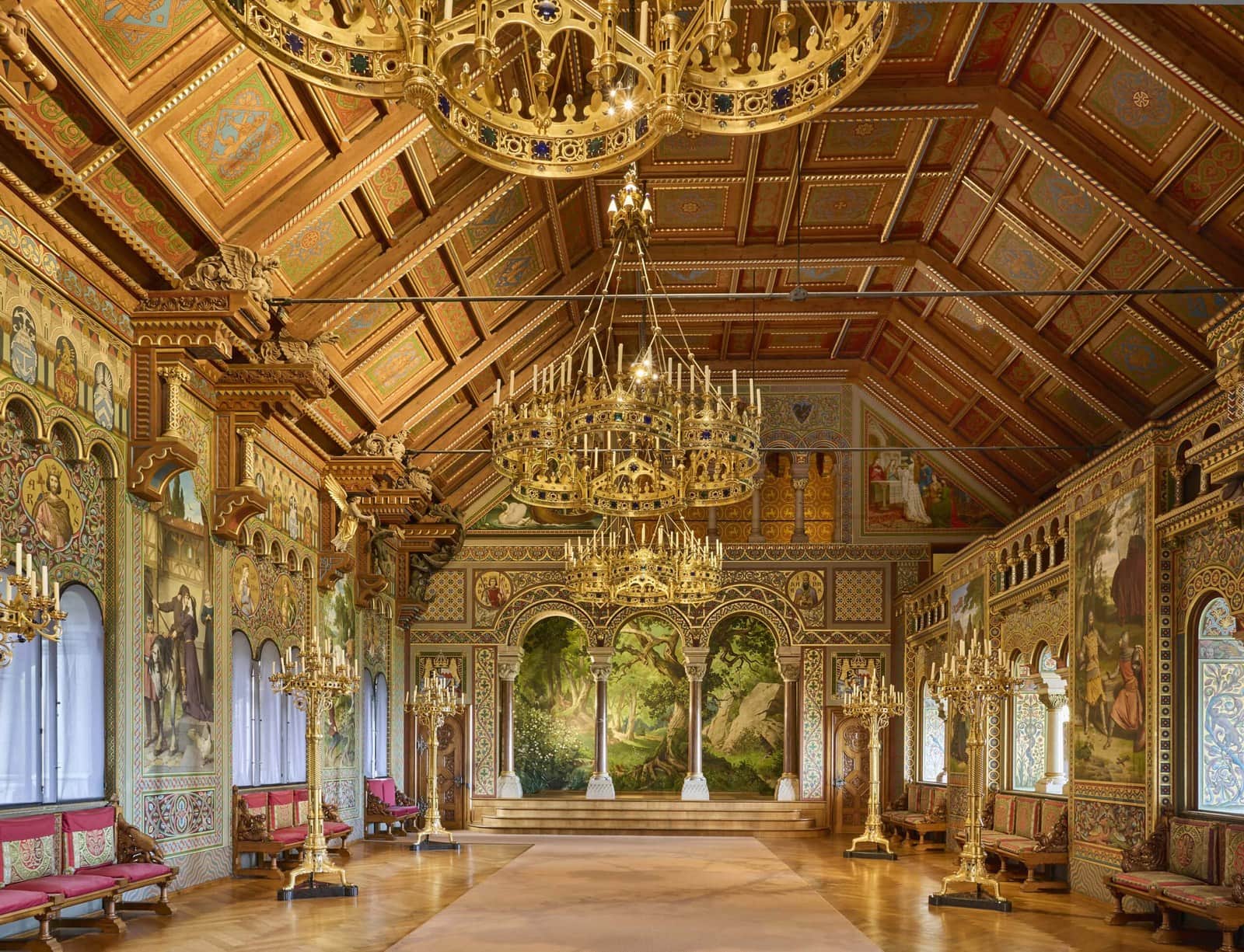 Neuschwanstein Castle 8 The Singers' Hall of Neuschwanstein Castle, with a painted coffered ceiling, gilt chandeliers, Parzival murals, and an arcaded stage painted as a forest