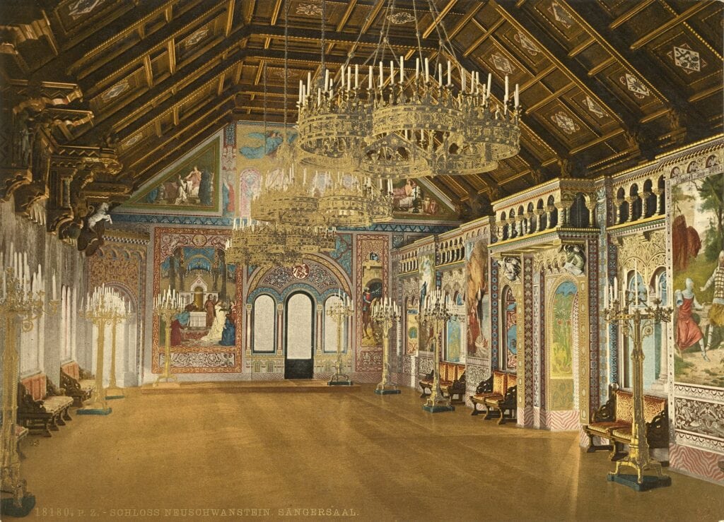 Neuschwanstein Castle 21 The Singers' Hall of Neuschwanstein Castle, with a coffered wooden ceiling, twin chandeliers, and murals of the Parzival legend, shown in a color photochrom of about 1900