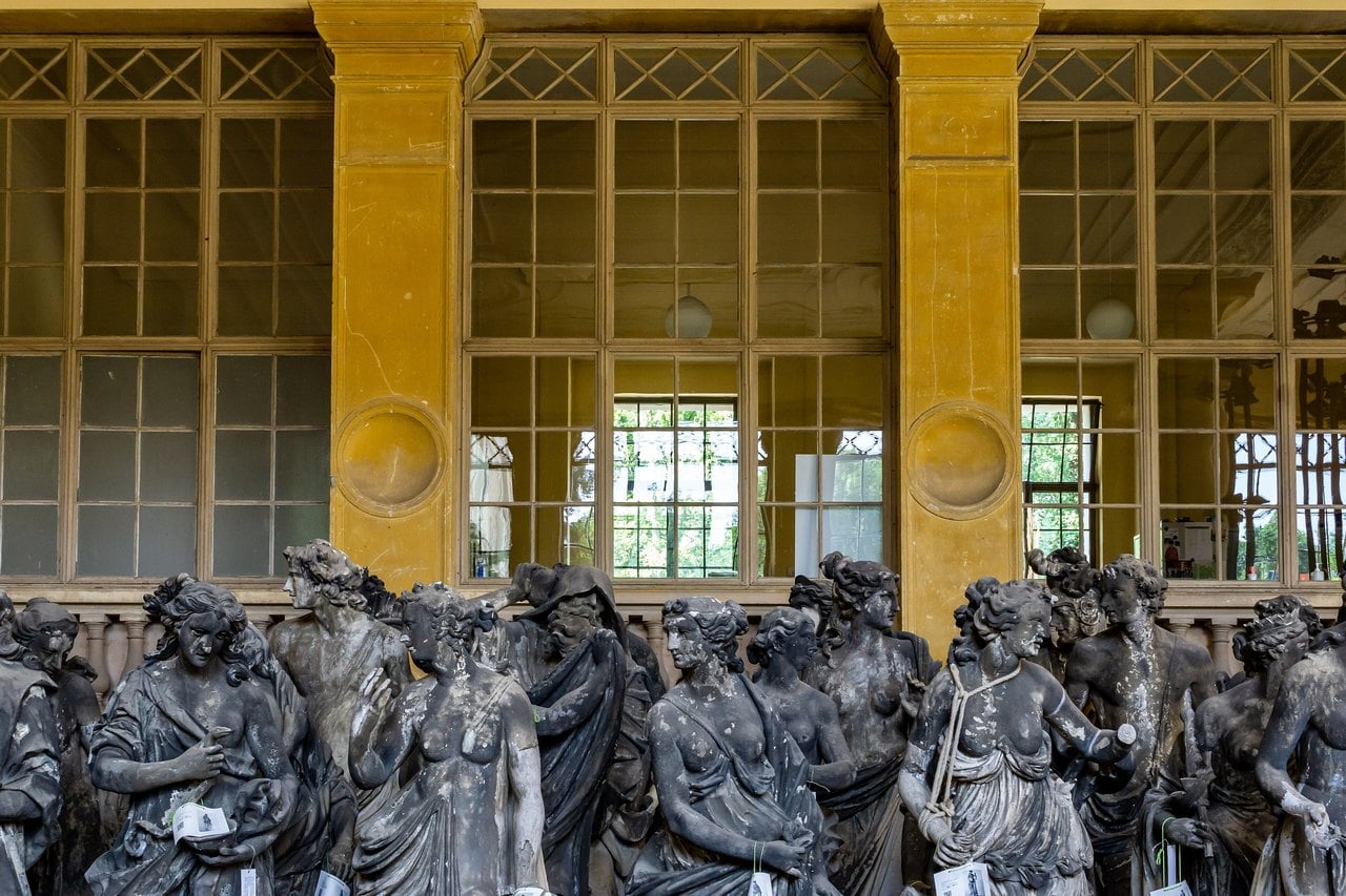 Orangery Palace 8 The long west plant hall of the Orangery Palace, lined with tall windows and filled with garden statuary in the off-season