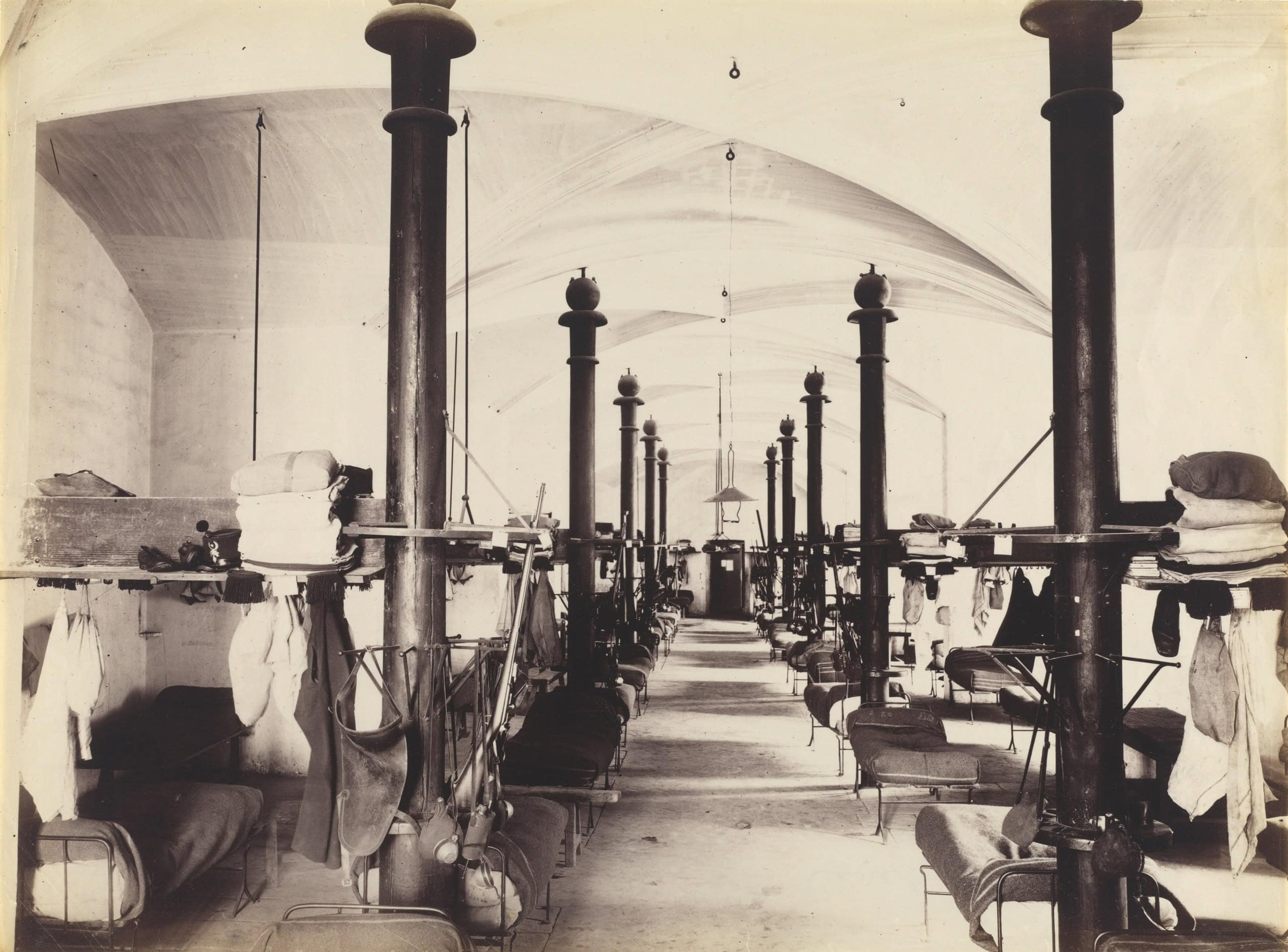 The Palais des Papes as a barracks, 1860s A 19th-century photograph of a hall of the Palais des Papes filled with military beds during its use as a barracks