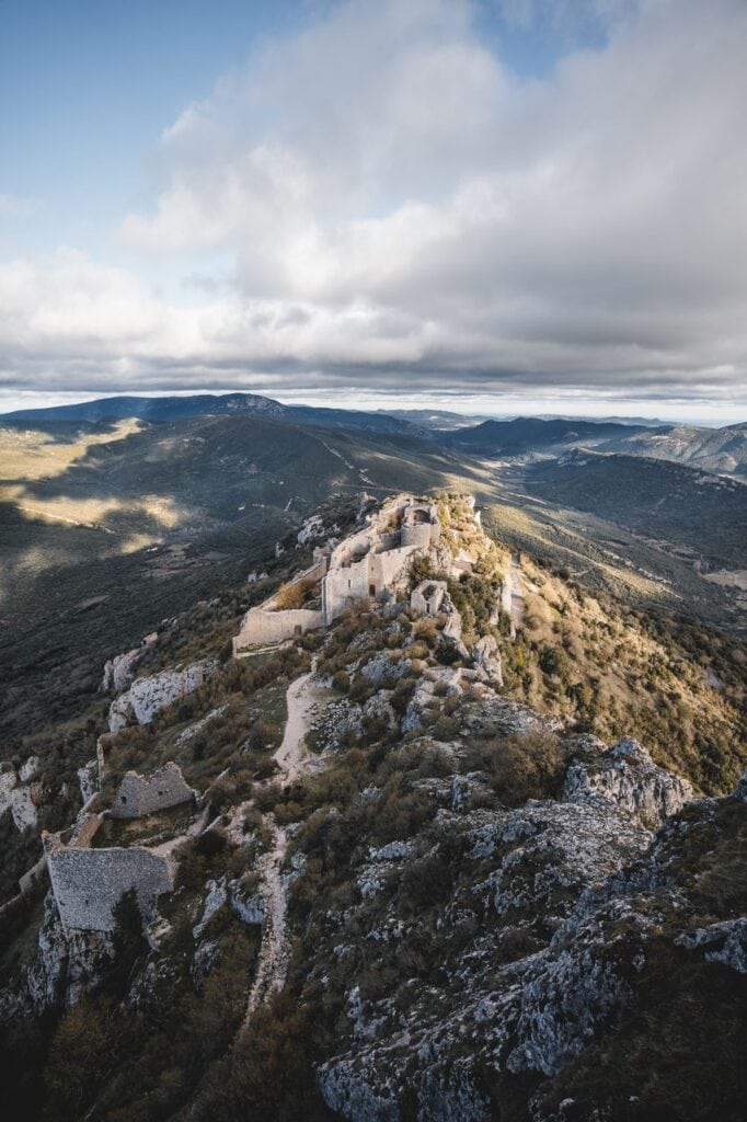 Château de Peyrepertuse 4 Aerial view down the ridge of Peyrepertuse beneath cloud
