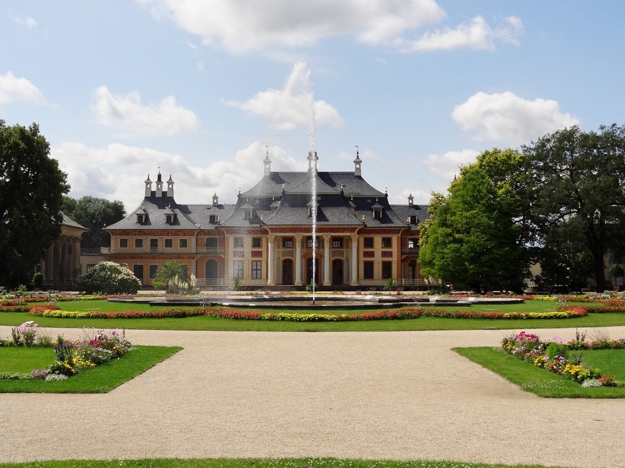 Pillnitz Castle 4 The Baroque flower garden and central fountain at Schloss Pillnitz with the New Palace behind