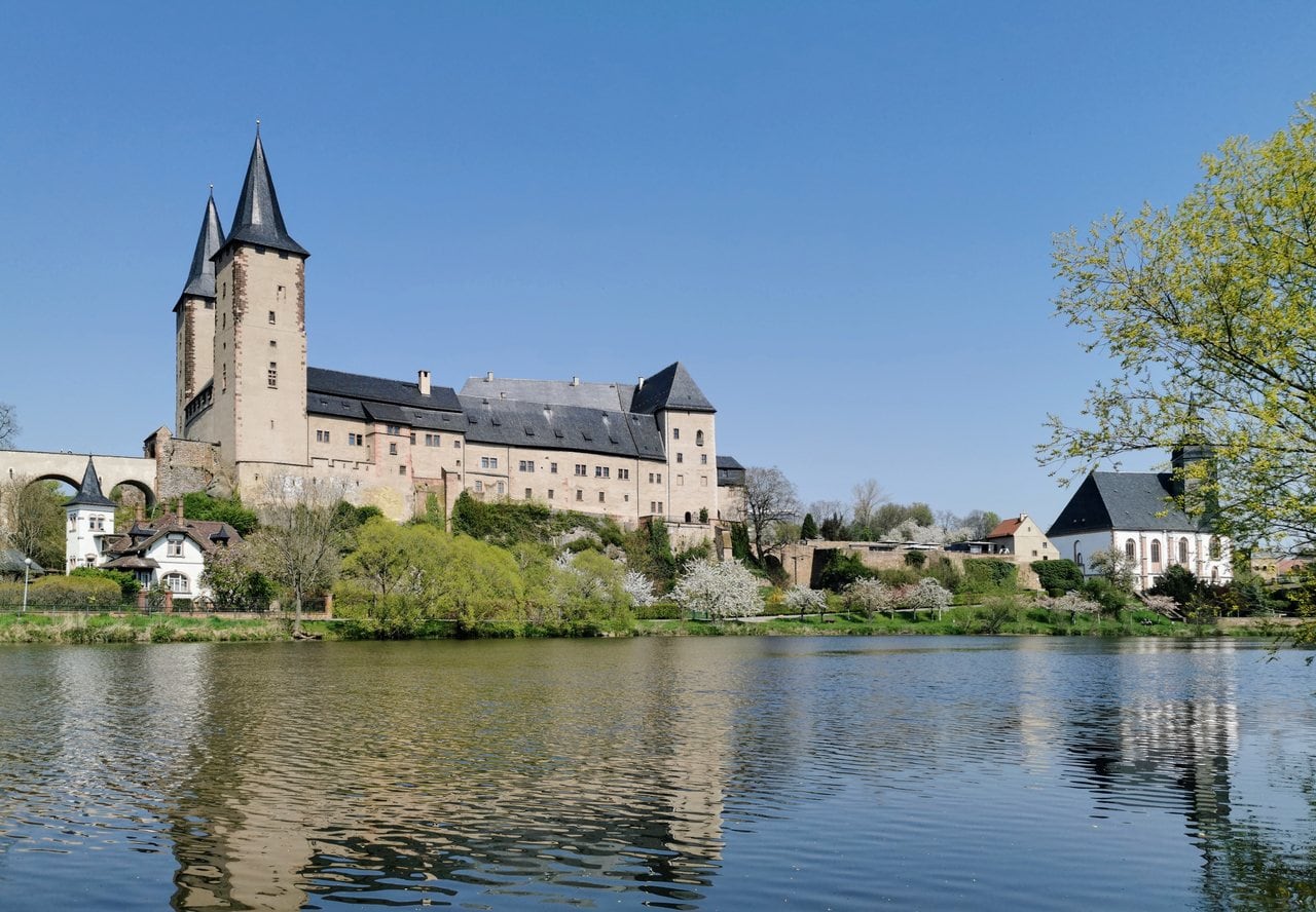 Rochlitz Castle 1 Rochlitz Castle's twin Gothic towers, the Lichte Jupe and Finstere Jupe, rising above the Zwickauer Mulde in spring