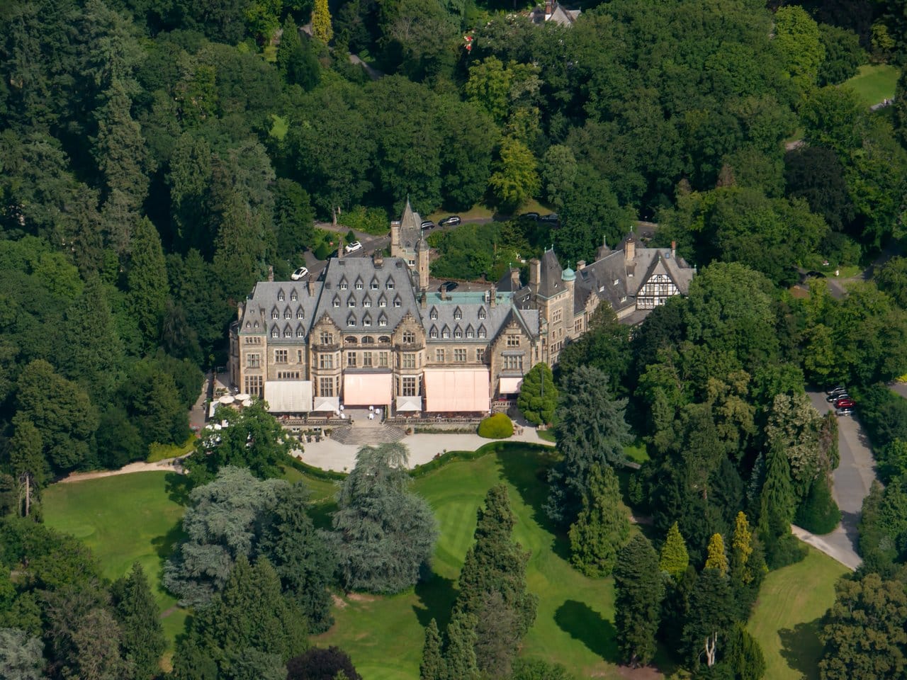 Castle Hotels in Germany: Where You Can Actually Sleep Inside the History 5 Schlosshotel Kronberg, the former Schloss Friedrichshof near Frankfurt, seen from the air