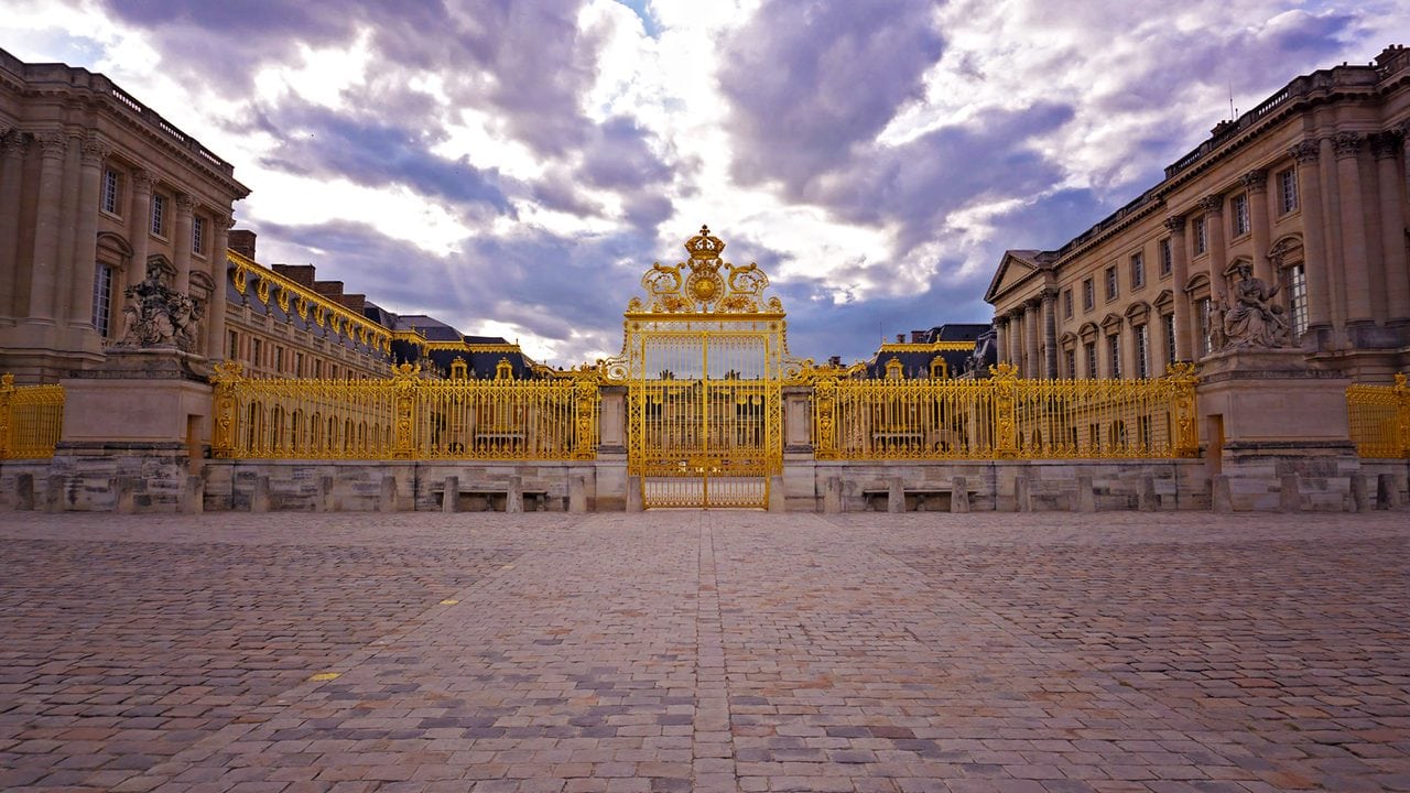 Palace of Versailles 10 The gilded Royal Gate at the entrance to the Palace of Versailles, crowned with the royal coat of arms