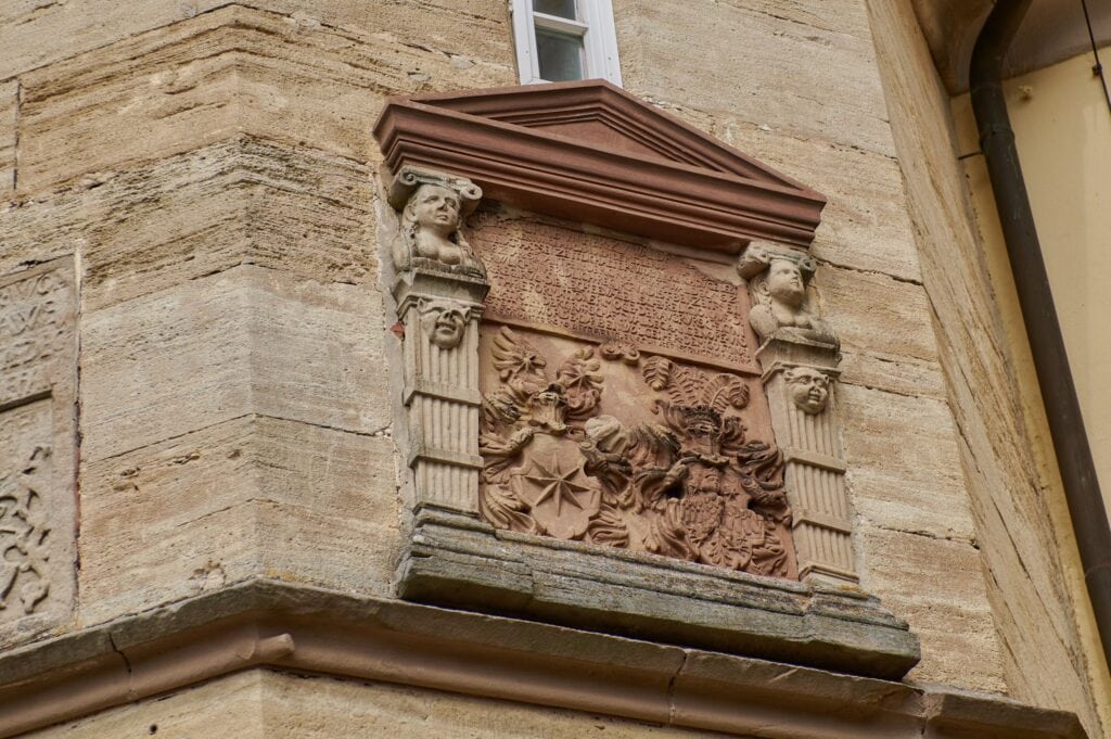 Carved heraldic reliefs on the octagonal stair tower of Waldeck Castle
