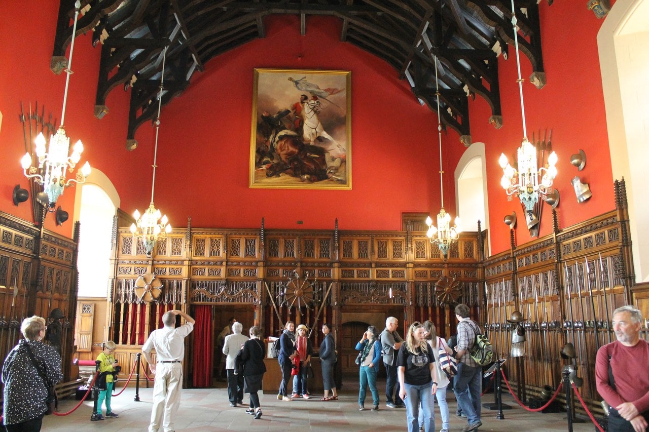 The Great Hall of Edinburgh Castle, its hammerbeam timber roof rising on carved corbels above the paneled walls and displays of arms. The Great Hall of Edinburgh Castle, its hammerbeam timber roof rising on carved corbels above the paneled walls and displays of arms.