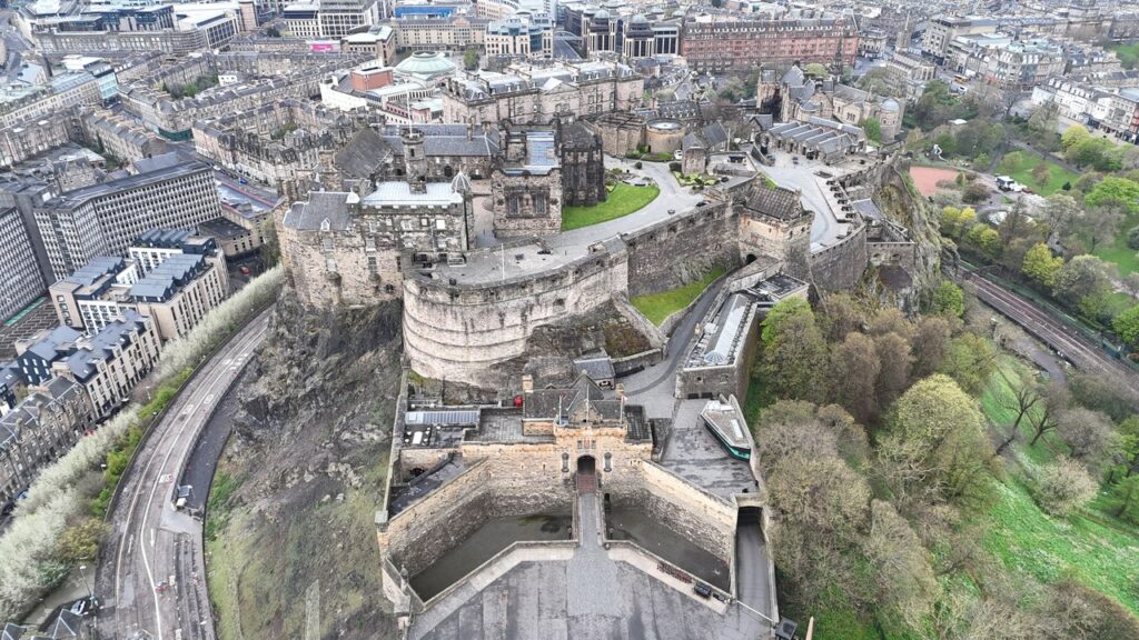 Edinburgh Castle 11 Looking down on Edinburgh Castle from above, the curved Half Moon Battery and the tiered defenses stepping down the crag toward the city.