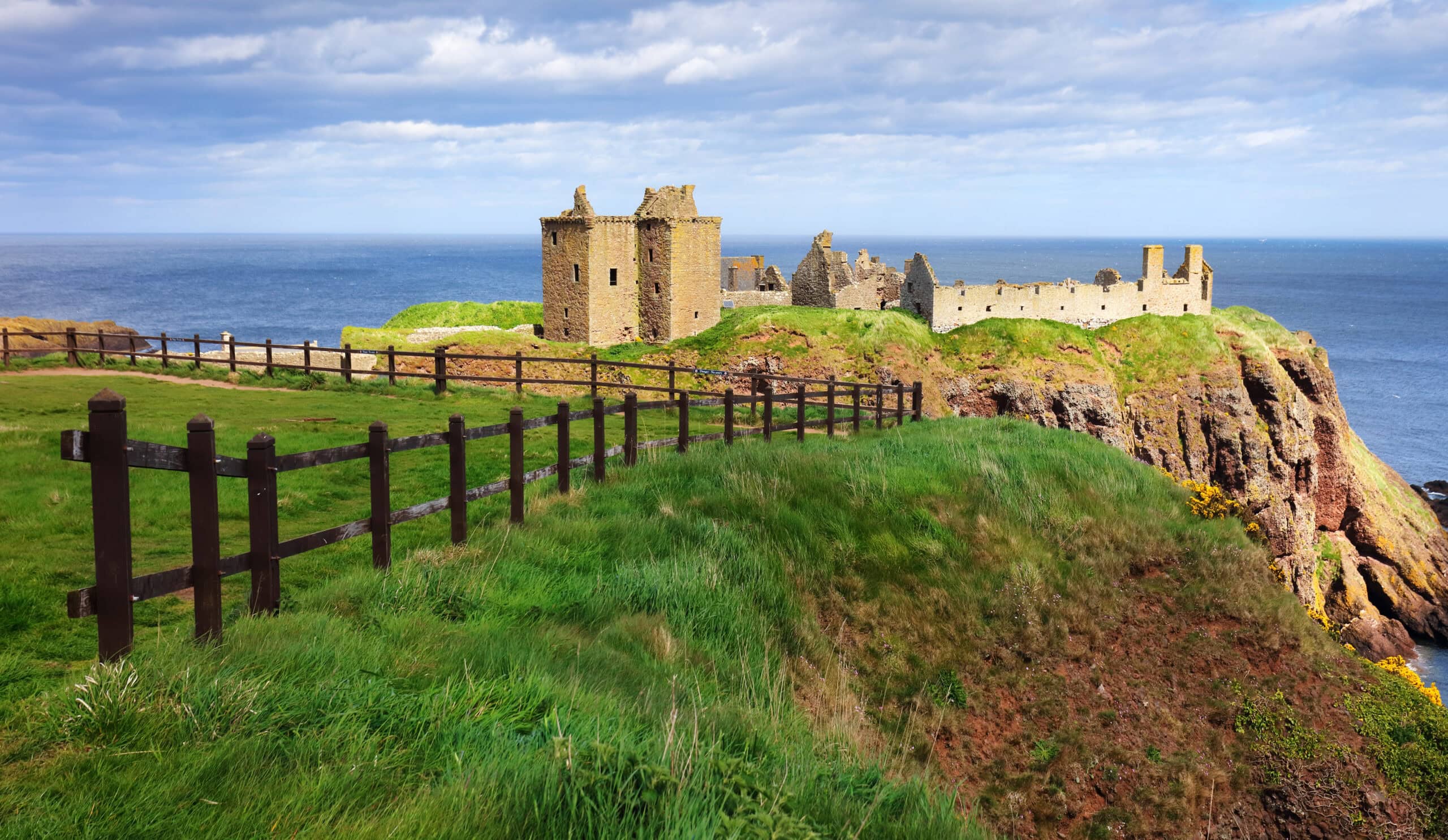 The coastal path from Stonehaven running along the cliff top to the ruins of Dunnottar Castle on its sea-girt rock. The coastal path from Stonehaven running along the cliff top to the ruins of Dunnottar Castle on its sea-girt rock.