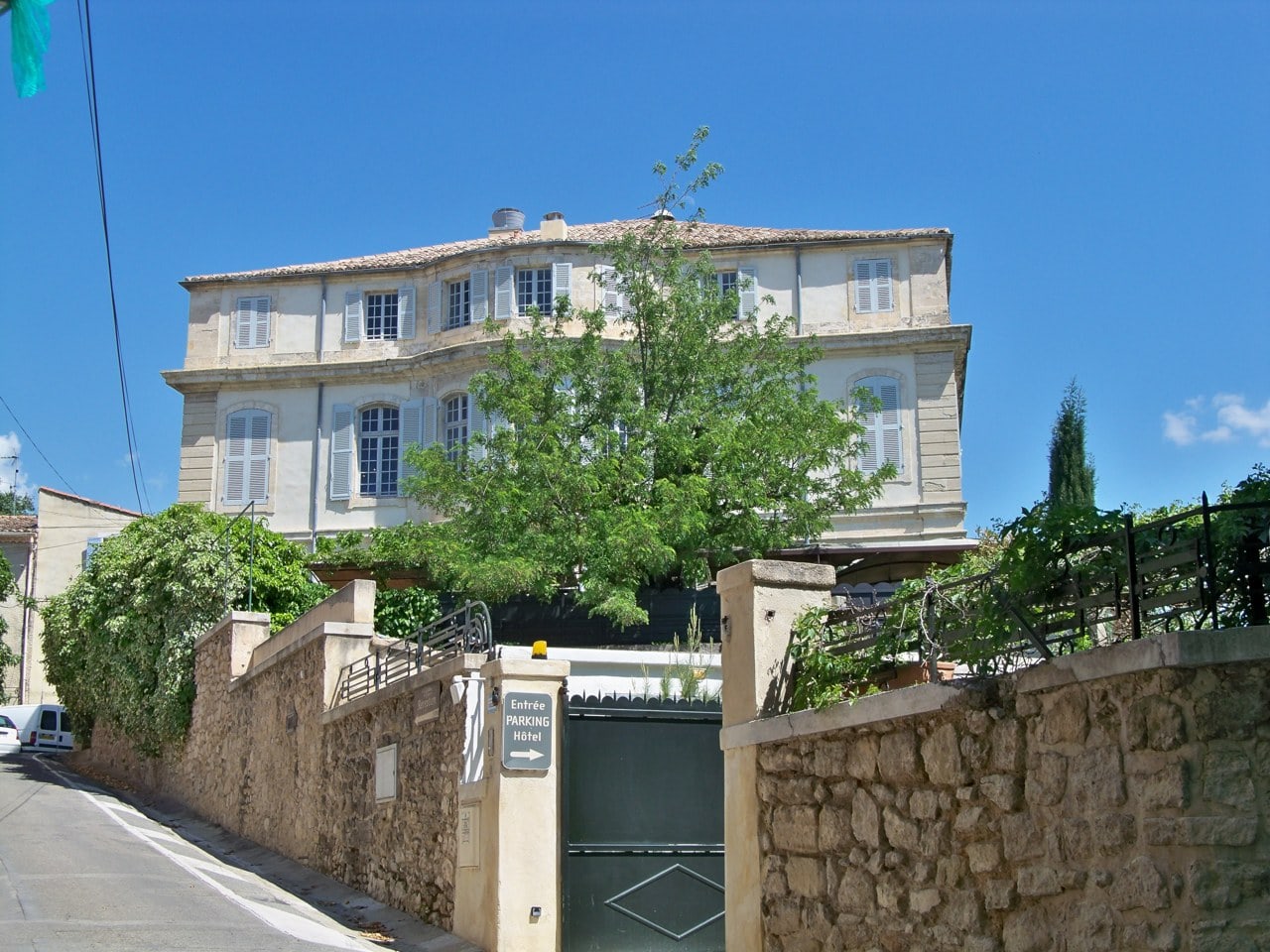 Chateau de Mazan, an eighteenth-century Provencal chateau hotel behind its garden wall Chateau de Mazan, an eighteenth-century Provencal chateau hotel behind its garden wall