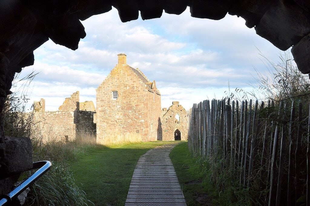 Dunnottar Castle 8 View from inside the entrance archway at Dunnottar Castle along a boardwalk path into the palace quadrangle.