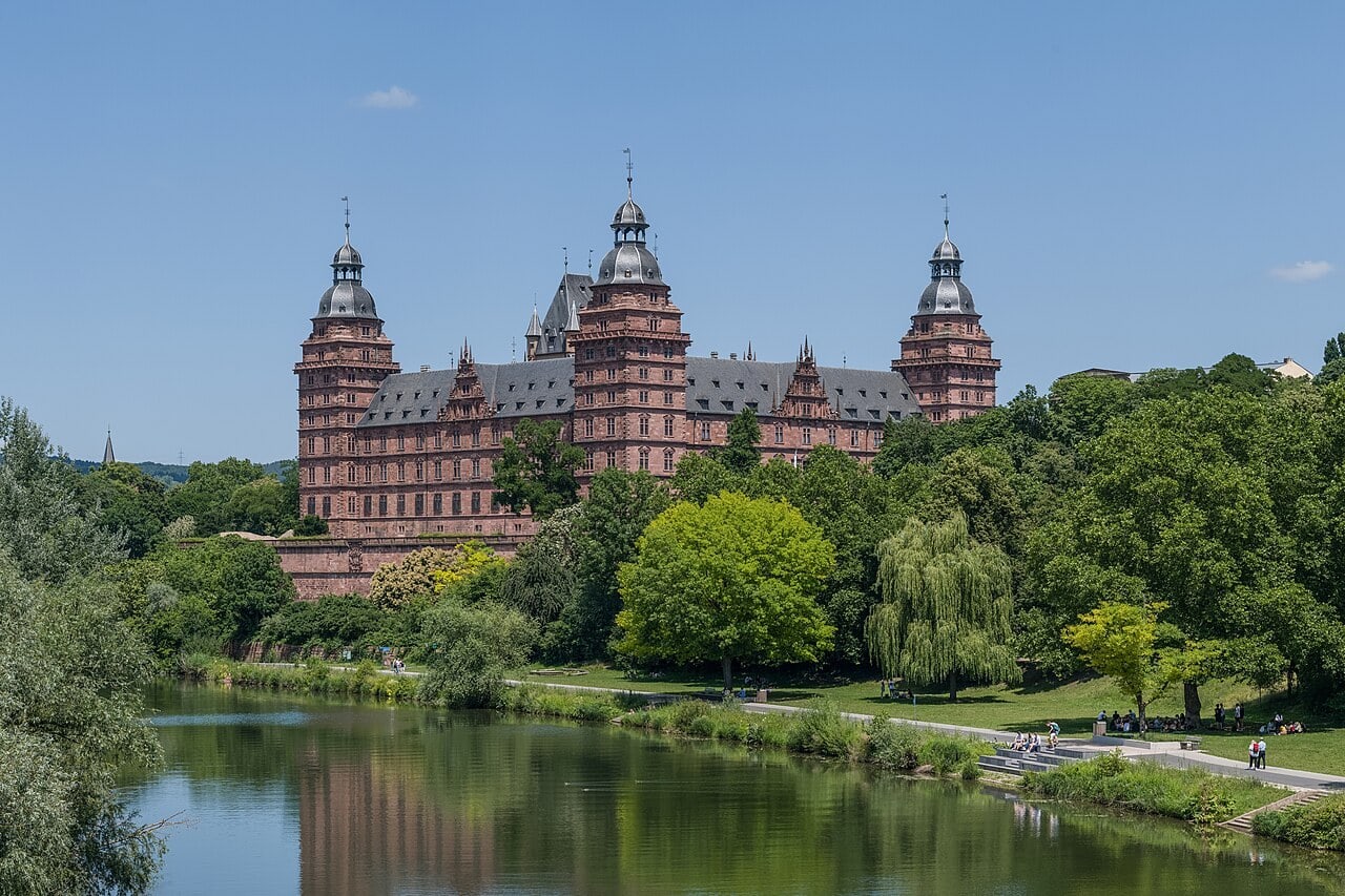 Schloss Johannisburg, the four-wing red-sandstone late-Renaissance palace with onion-domed corner towers, above the river Main at Aschaffenburg