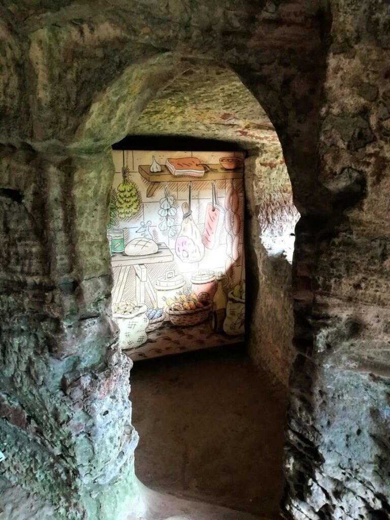 Château de Fleckenstein 6 An illustrated interpretation panel in a rock-cut pantry at Fleckenstein