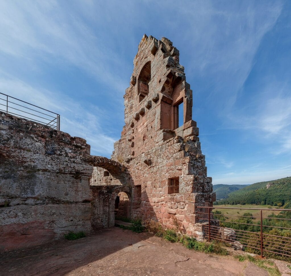 Château de Fleckenstein 2 A red-sandstone tower fragment with a window at Fleckenstein against blue sky