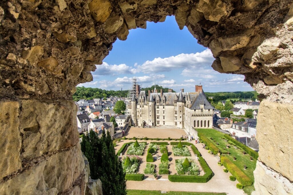 Château de Langeais 3 The chateau's towers framed through a window of the ruined keep. Photo: Vincent Courceleaud / Adobe Stock.