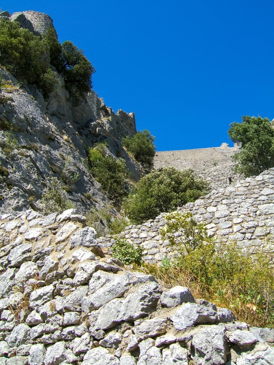 The zigzag stairway climbing to the gate of Château de Puilaurens The zigzag stairway climbing to the gate of Château de Puilaurens