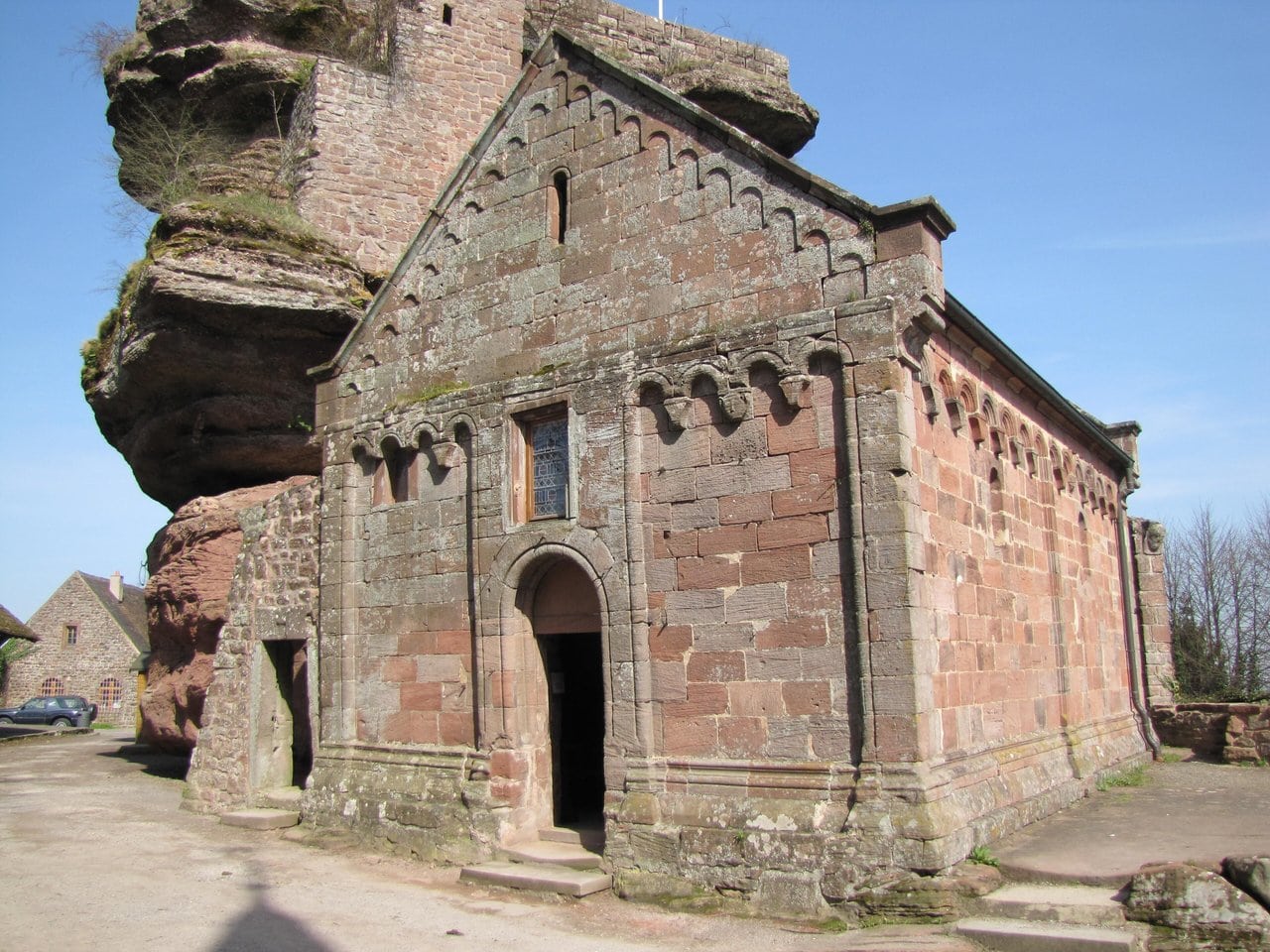 Romanesque chapel of Saint-Nicolas at Château du Haut-Barr with blind arcading, keep rock behind Romanesque chapel of Saint-Nicolas at Château du Haut-Barr with blind arcading, keep rock behind