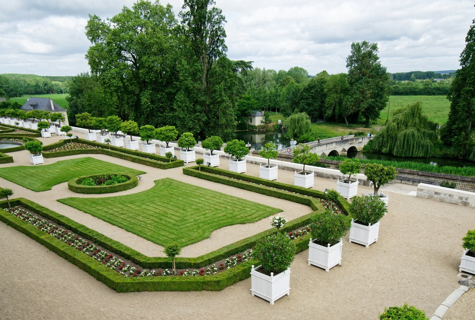 The garden terraces and the stone bridge over the Indre below Château d'Ussé The garden terraces and the stone bridge over the Indre below Château d'Ussé