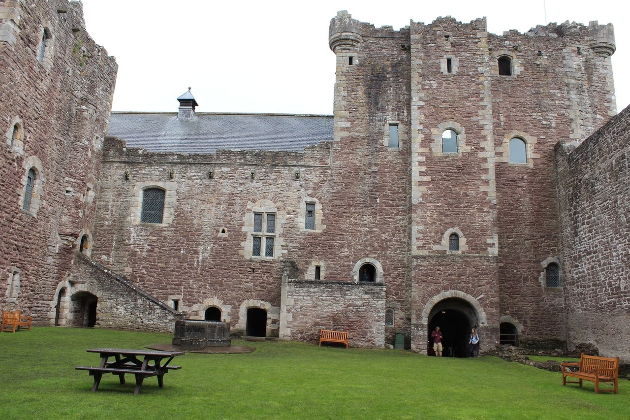 The courtyard of Doune Castle with the gatehouse tower and great-hall range