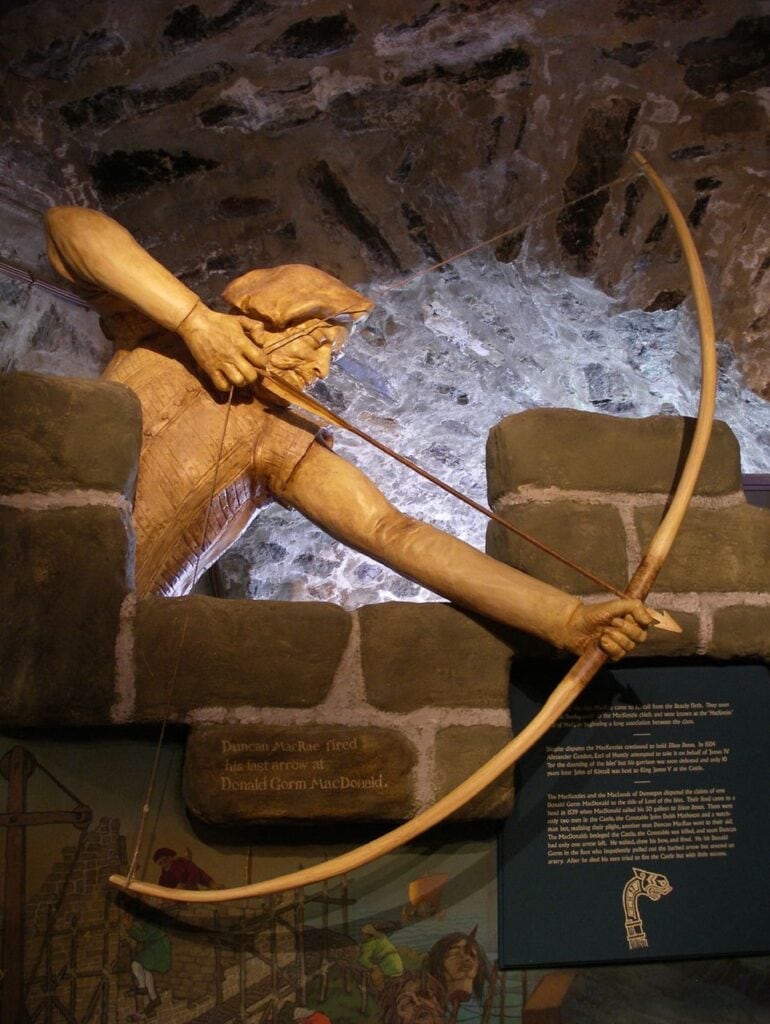 Eilean Donan Castle 12 A museum tableau re-creates Duncan MacRae loosing his last arrow at Donald Gorm MacDonald during the 1539 siege.