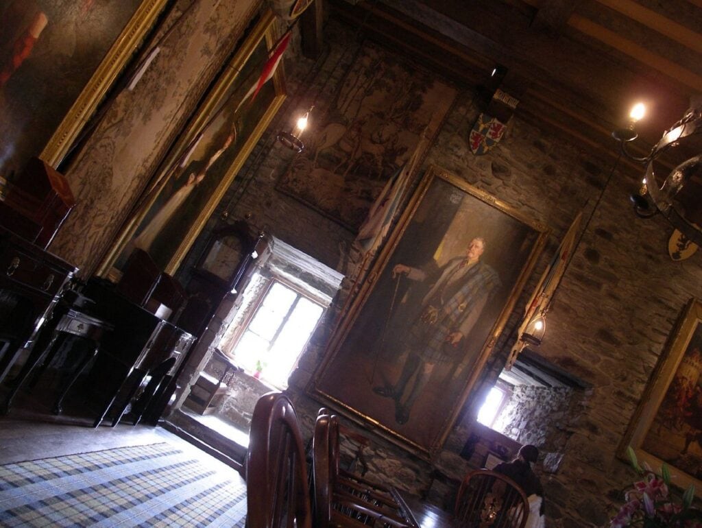Eilean Donan Castle 2 The rebuilt Banqueting Hall is hung with clan MacRae portraits, tapestries and heraldry beneath an exposed timber ceiling.