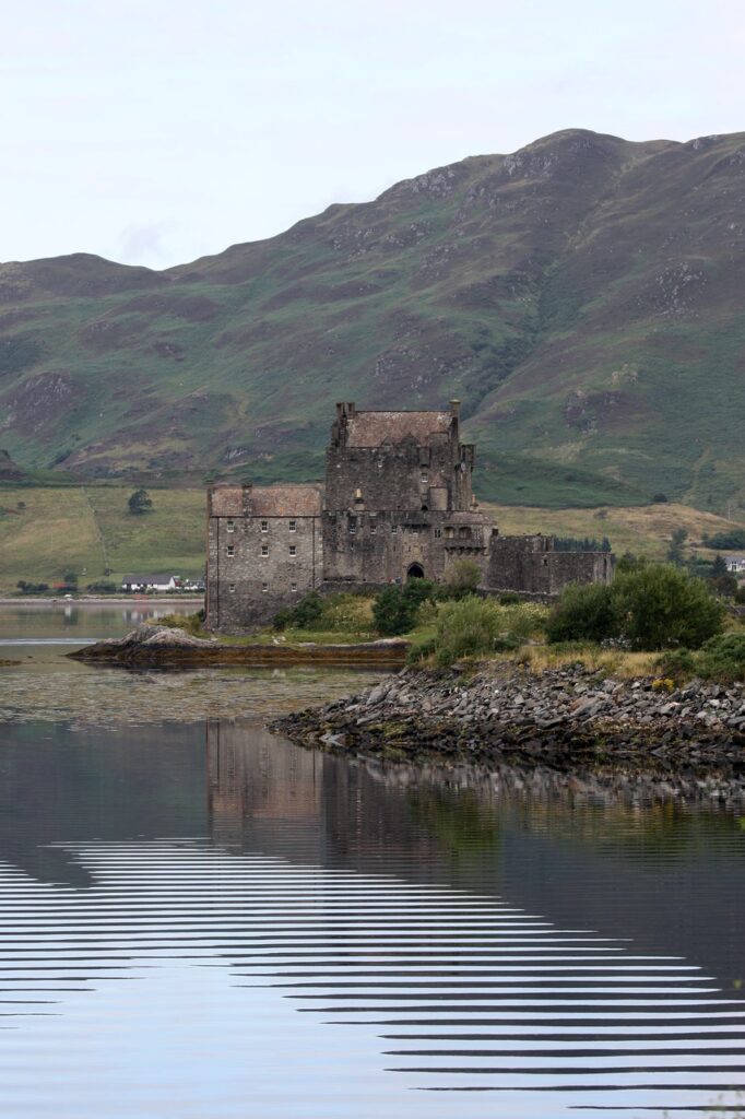 Eilean Donan Castle 7 Ripples cross Loch Duich in front of the island castle and its reflected tower house.