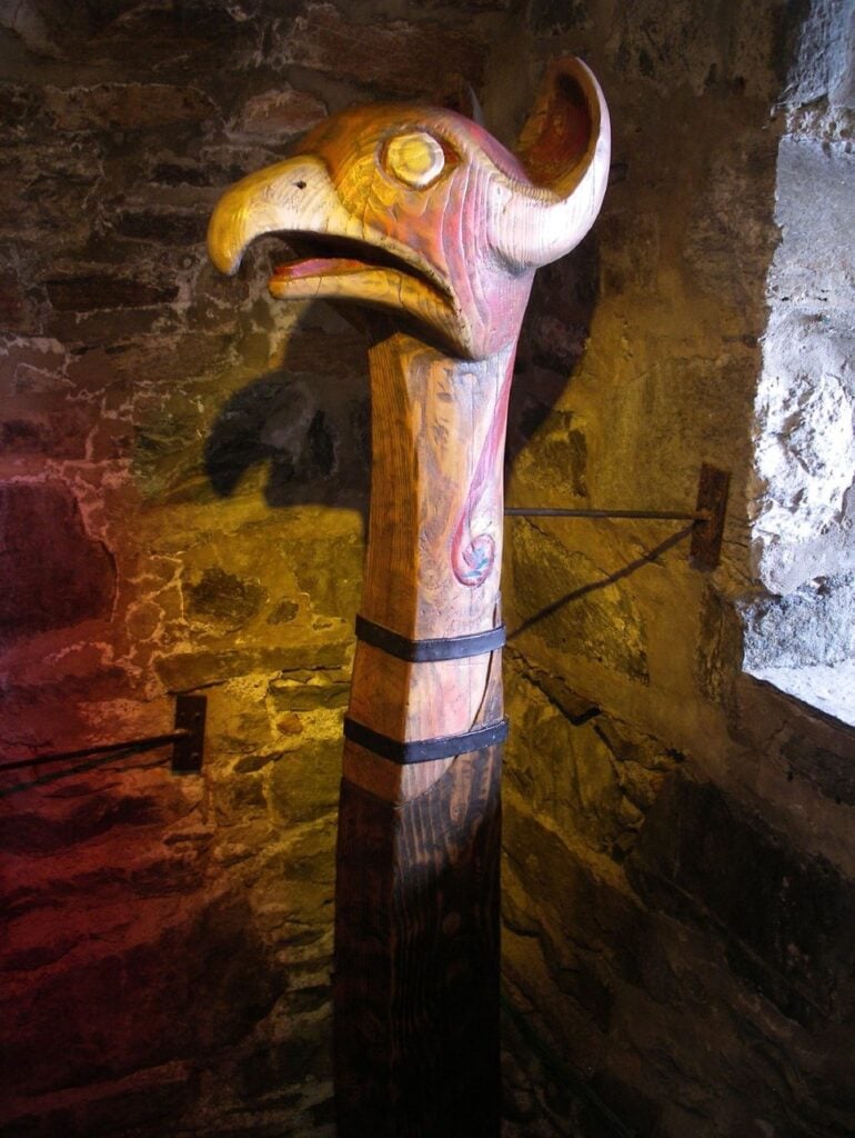 Eilean Donan Castle 13 A carved wooden longship figurehead displayed inside the castle.