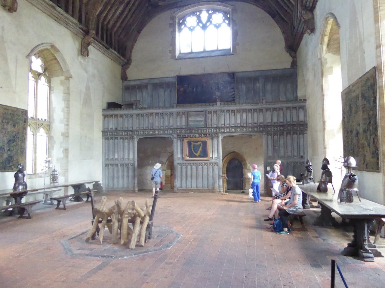 The medieval great hall at Penshurst Place, with an octagonal central hearth on the tiled floor, trestle tables and a carved timber screen beyond. The medieval great hall at Penshurst Place, with an octagonal central hearth on the tiled floor, trestle tables and a carved timber screen beyond.
