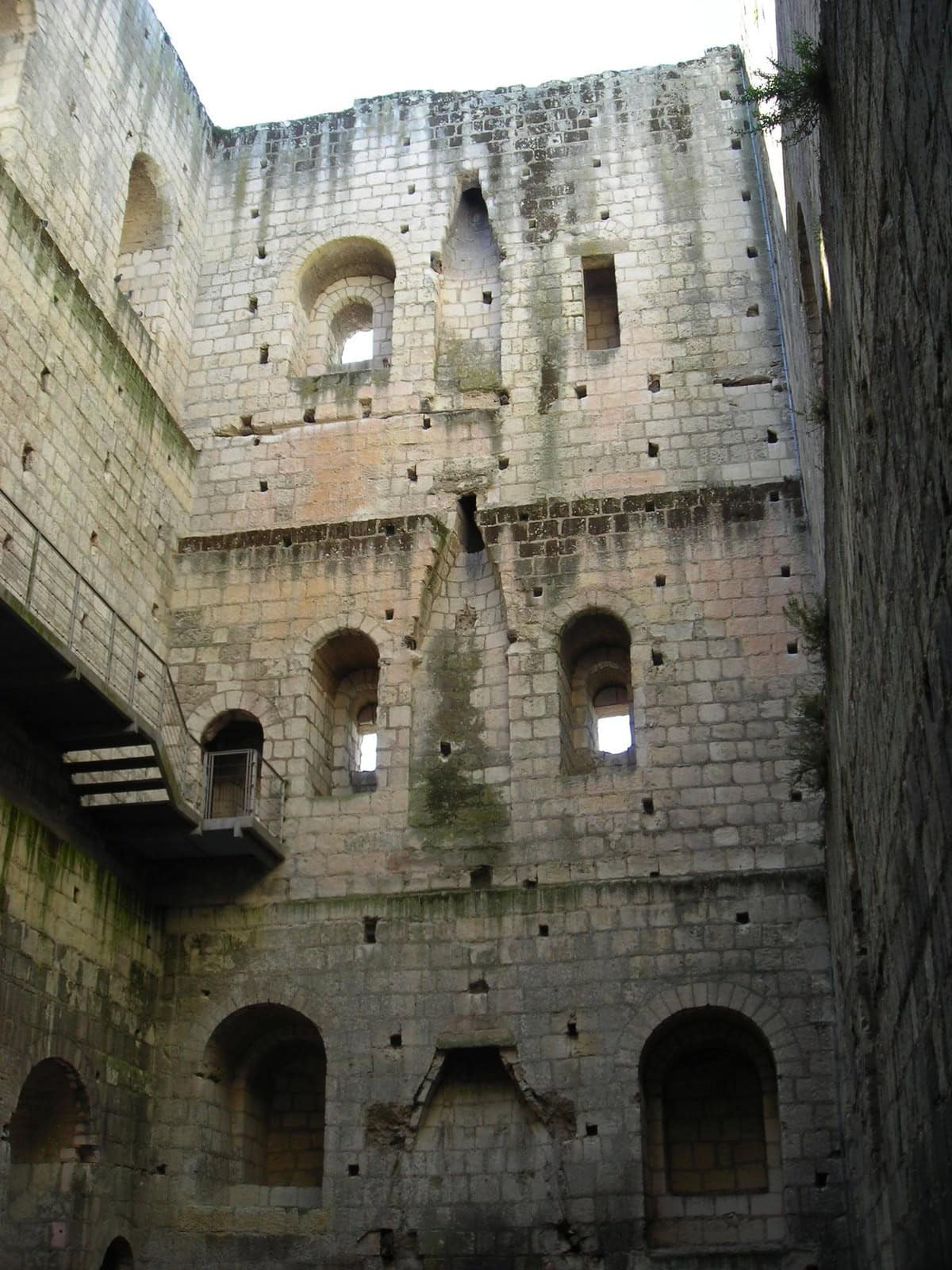 Interior of the roofless keep of Loches showing tiers of window embrasures. Interior of the roofless keep of Loches showing tiers of window embrasures.