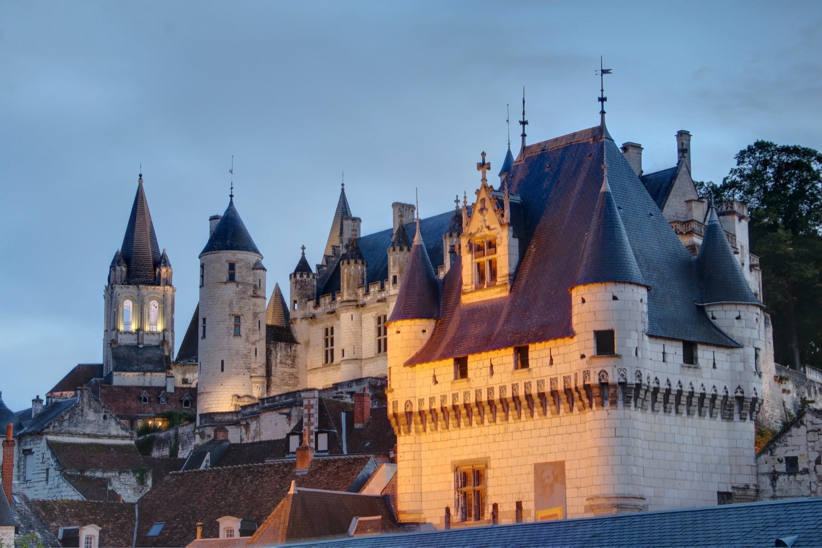 The flamboyant Gothic Logis Royal of Loches lit at golden hour. The flamboyant Gothic Logis Royal of Loches lit at golden hour.