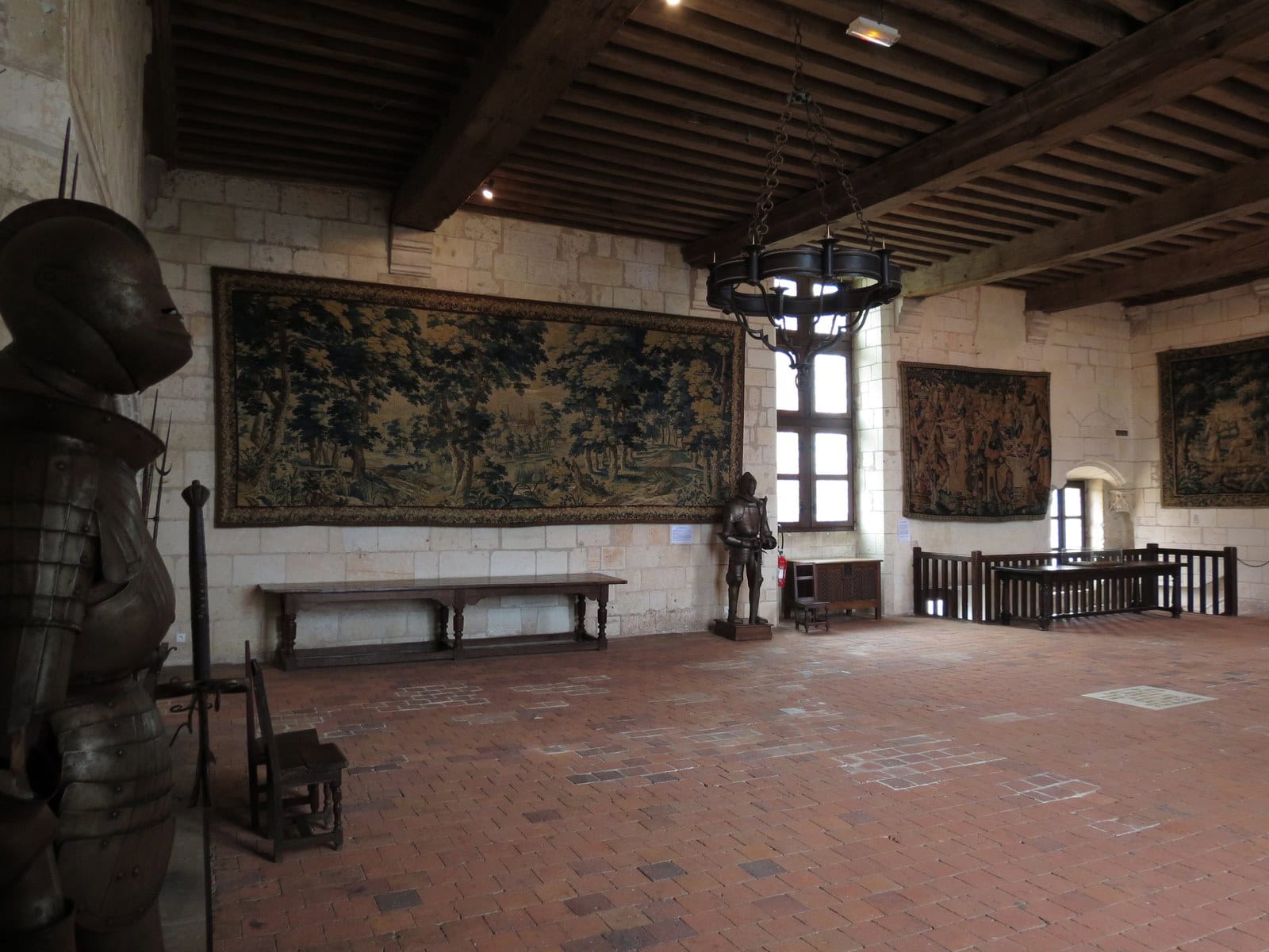 The great hall of the Logis Royal at Loches, hung with tapestries beneath a beamed ceiling. The great hall of the Logis Royal at Loches, hung with tapestries beneath a beamed ceiling.