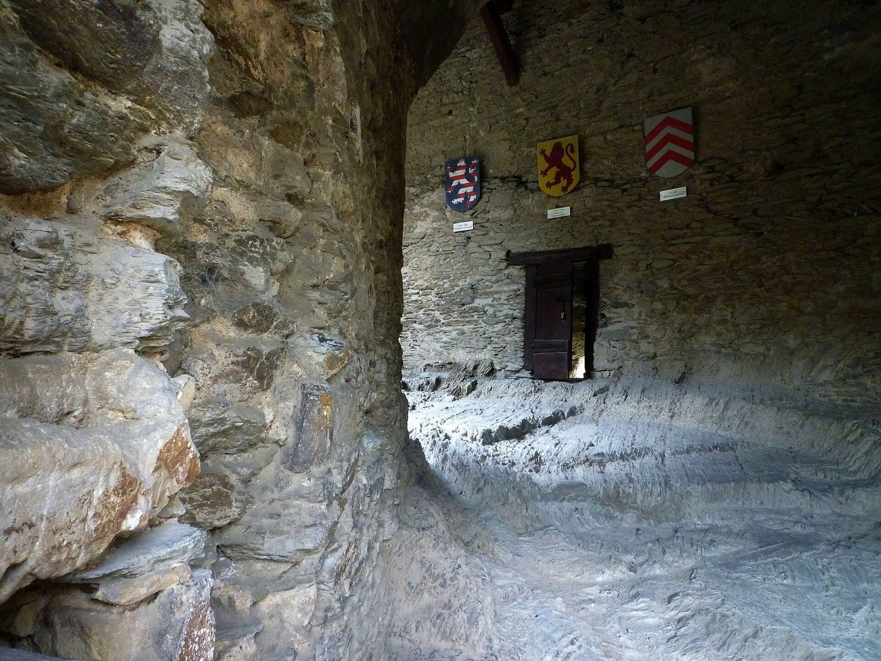 The Reitertreppe at Marksburg, cut through bedrock, with painted shields on the rock