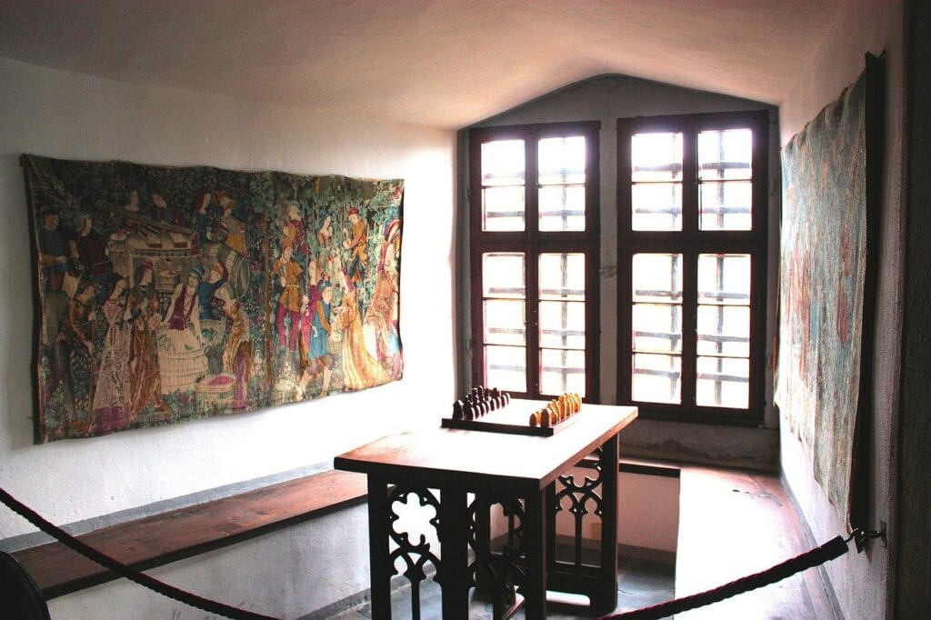 A tapestry beside the window in a residential room at Marksburg