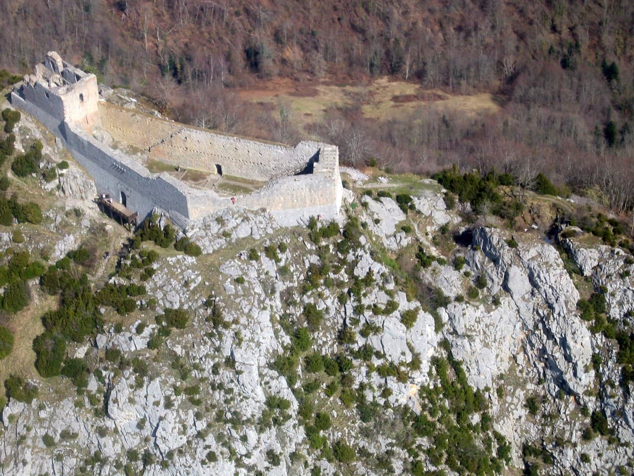 Aerial view of the elongated enceinte of Montségur, the post-1244 royal fortress Aerial view of the elongated enceinte of Montségur, the post-1244 royal fortress
