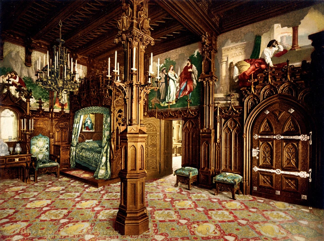 The King's Bedroom at Neuschwanstein with its neo-Gothic carved-oak canopy bed, in a photochrom of about 1900 The King's Bedroom at Neuschwanstein with its neo-Gothic carved-oak canopy bed, in a photochrom of about 1900