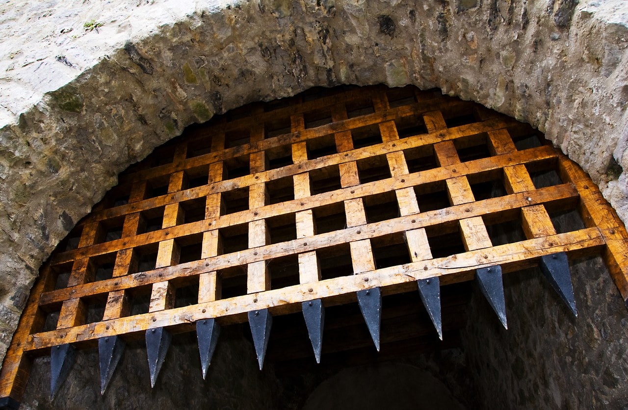 An oak portcullis part-lowered in the gateway of Cahir Castle, Ireland An oak portcullis part-lowered in the gateway of Cahir Castle, Ireland