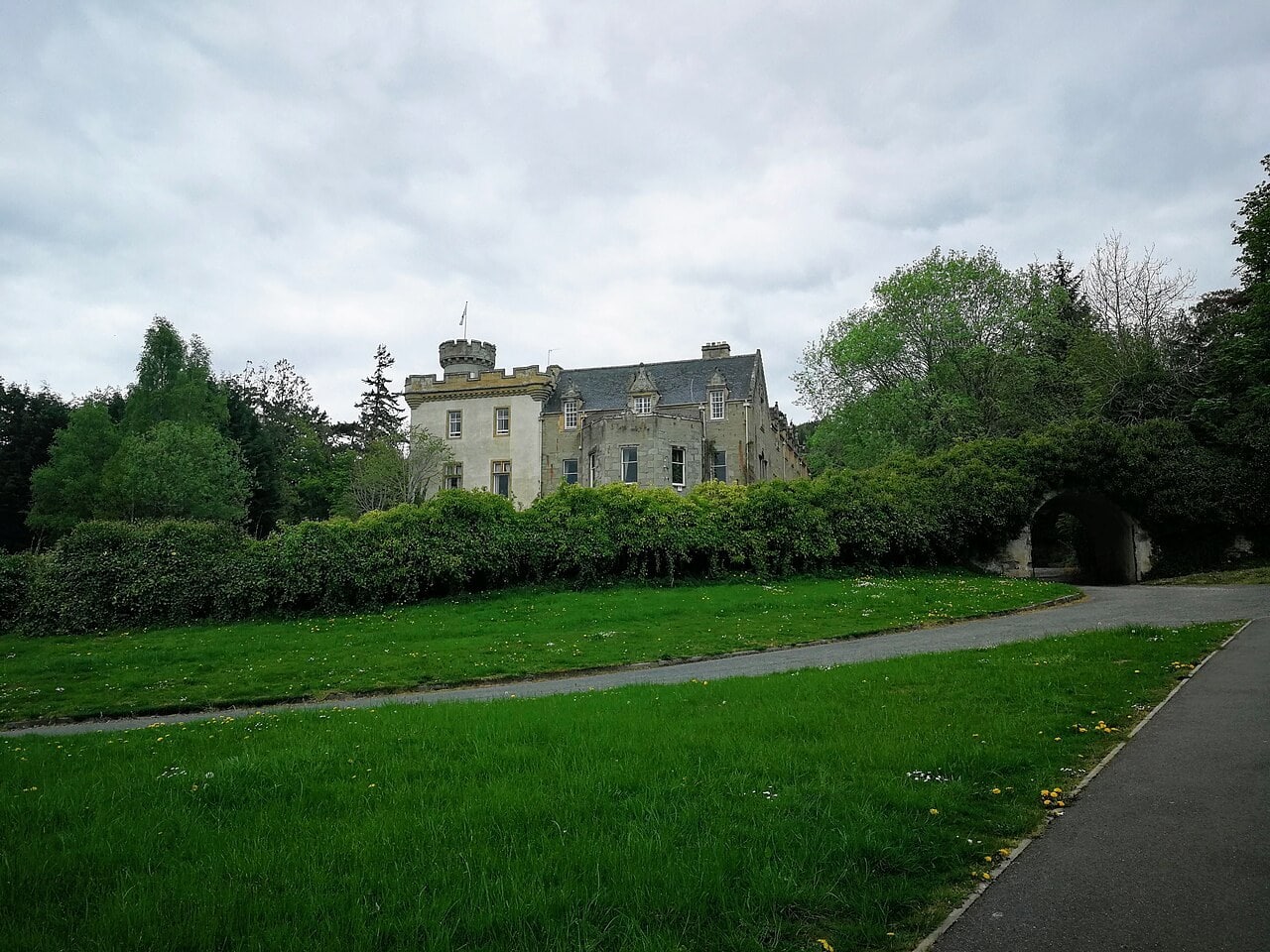 Tulloch Castle Hotel Tulloch Castle with round tower above its lawns