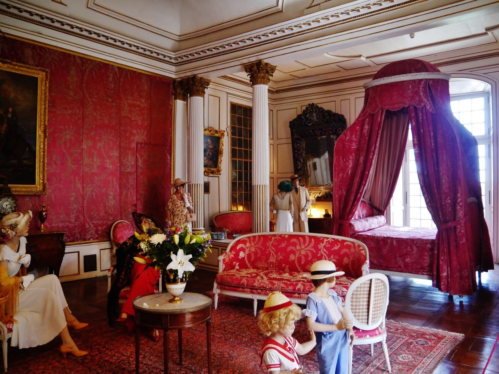 The Chambre du Roi at Château d'Ussé, hung with red Tours silk, with costumed figures The Chambre du Roi at Château d'Ussé, hung with red Tours silk, with costumed figures