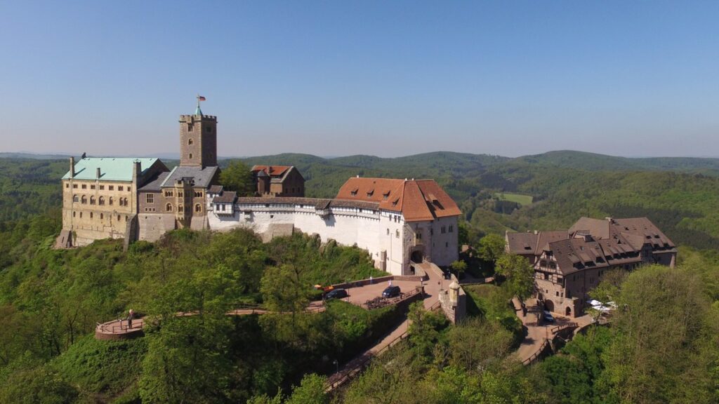 Aerial view of Wartburg Castle on its ridge above the Thuringian Forest near Eisenach