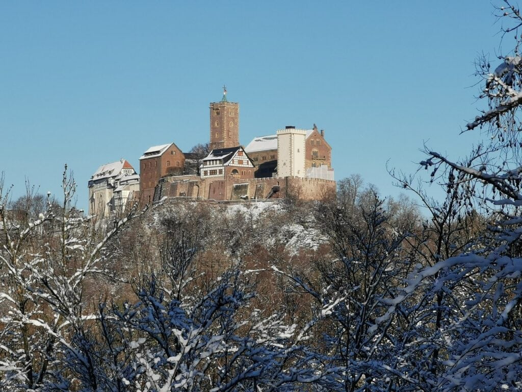 Wartburg Castle under snow above the frosted Thuringian Forest