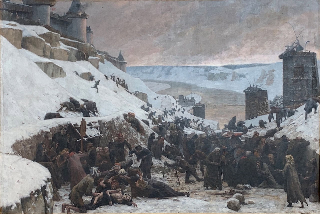 A nineteenth-century oil painting of crowds of starving expelled civilians in the snow below the walls of Château Gaillard, with timber siege towers on the slope behind them. A nineteenth-century oil painting of crowds of starving expelled civilians in the snow below the walls of Château Gaillard, with timber siege towers on the slope behind them.