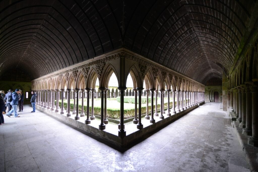 Mont-Saint-Michel 13 A corner of the cloister looking down two arcaded galleries with slender paired columns