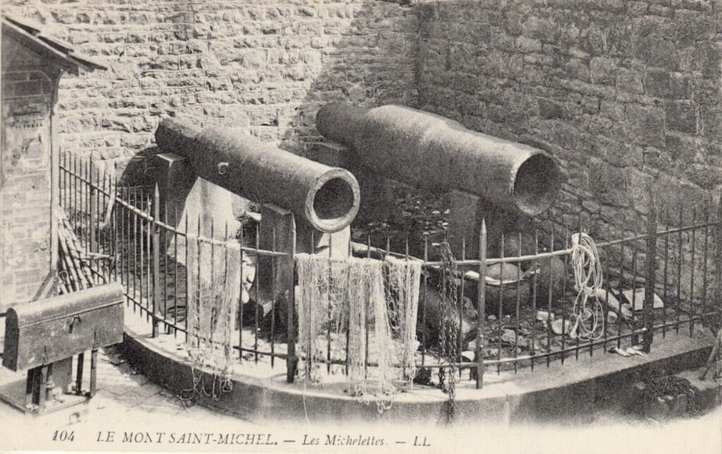 Mont-Saint-Michel 10 An early twentieth-century postcard showing two long bombards behind a railing against a stone wall