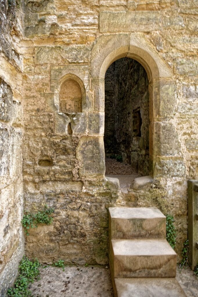 Stone doorway with steps leading into a wall passage at Bodiam Castle